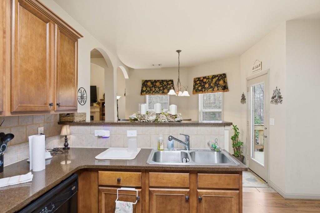 53 Bobbin Court Jefferson, GA 30549 - Photo 21 of 40 a kitchen with stainless steel appliances granite countertop a sink and a counter space