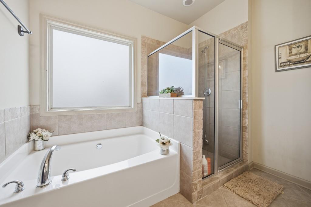 53 Bobbin Court Jefferson, GA 30549 - Photo 26 of 40 a bathroom with a tub and shower