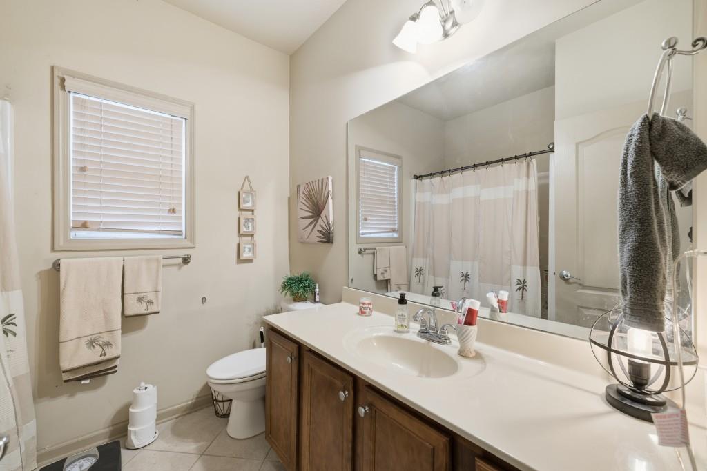 53 Bobbin Court Jefferson, GA 30549 - Photo 30 of 40 a bathroom with a sink a toilet and a mirror