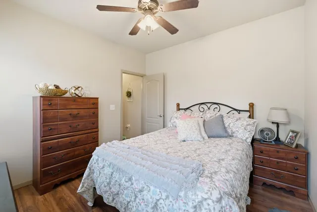 a bedroom with a bed and cabinets
