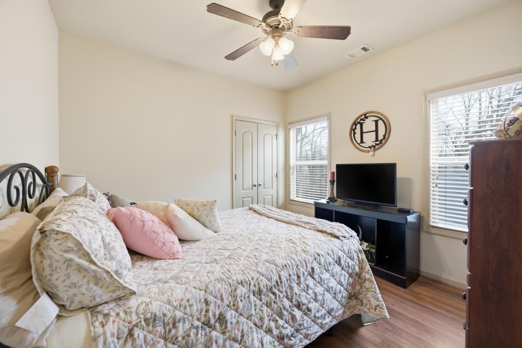 53 Bobbin Court Jefferson, GA 30549 - Photo 31 of 40 a bedroom with a bed and a flat screen tv