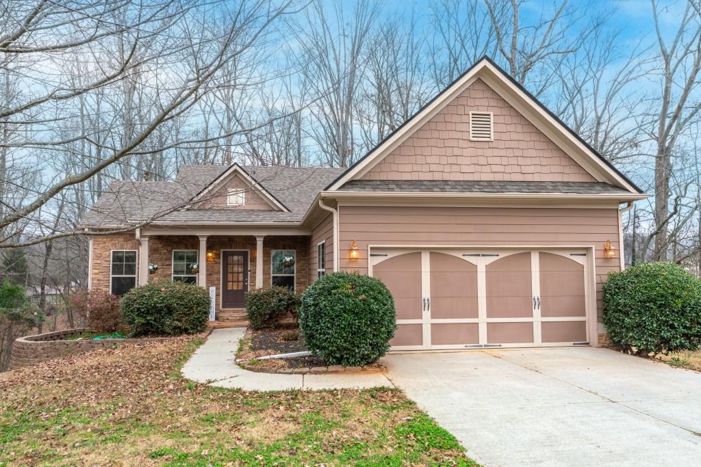 53 Bobbin Court Jefferson, GA 30549 - Photo 4 of 40 a view of a brick house with large windows