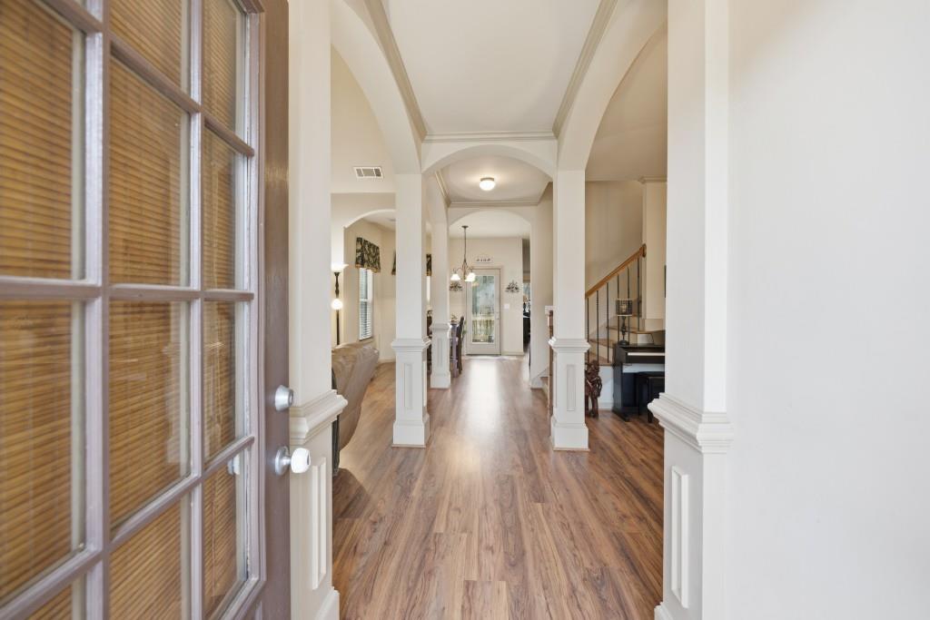 53 Bobbin Court Jefferson, GA 30549 - Photo 7 of 40 a view of a hallway with wooden floor and staircase