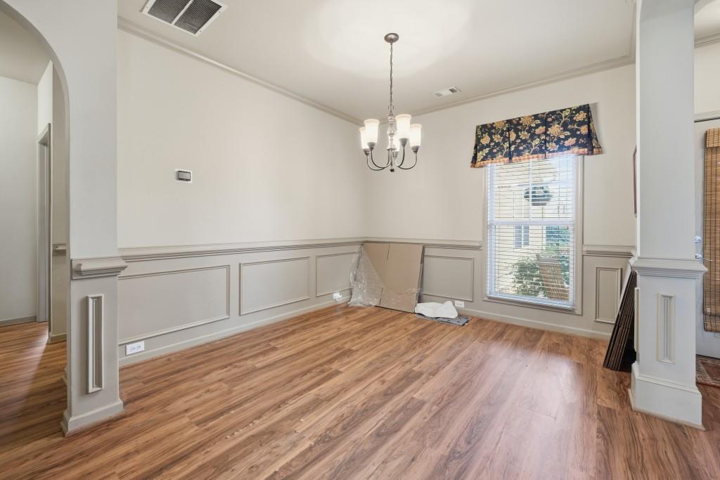 53 Bobbin Court Jefferson, GA 30549 - Photo 9 of 40 a view of an empty room with wooden floor and a window