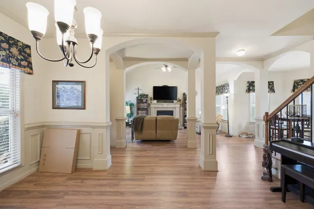 a view of a livingroom with furniture and a flat screen tv