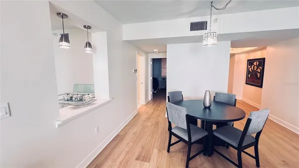 a kitchen with stainless steel appliances a sink stove refrigerator and cabinets