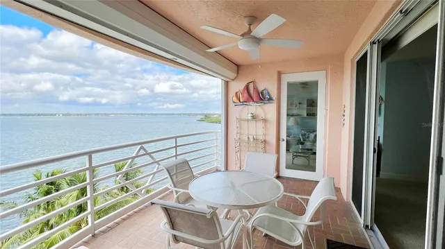 a view of a dining room with furniture and a potted plant