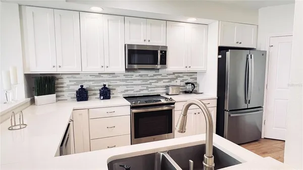 a bedroom with double bed and a window