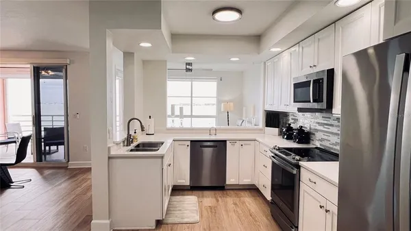 a view of outdoor space with wooden floor and fence