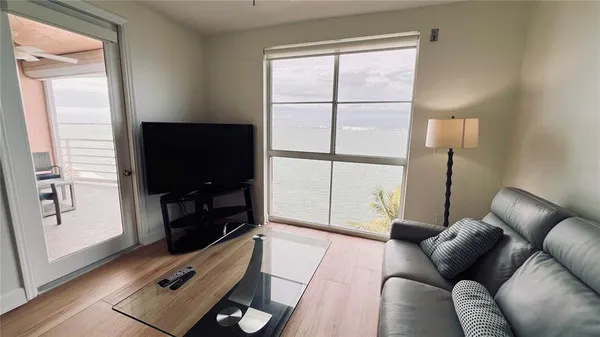 a view of a chairs and table in a balcony