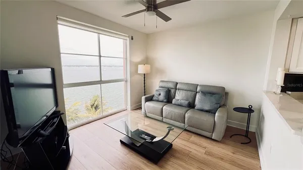 a bedroom with two beds and a painting on the wall