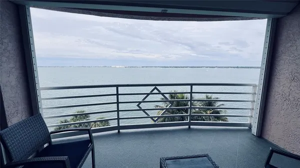 a view of a swimming pool with a yard