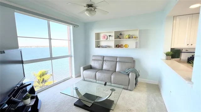 a bathroom with a sink mirror and shower