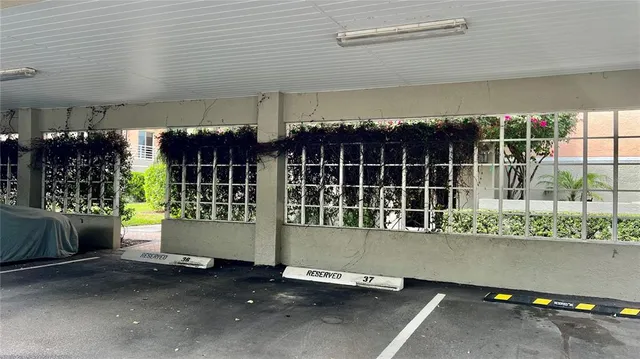 a swimming pool with outdoor seating and yard in back