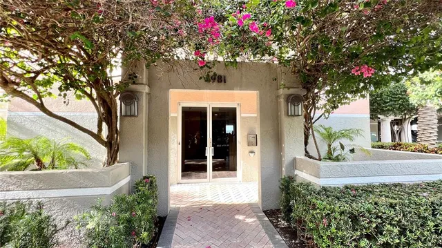 a view of a chairs and table in the balcony