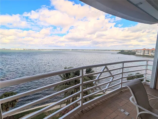 a dining room with furniture and a window