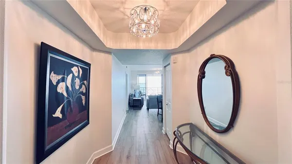 a living room with furniture or couch and a wooden floor