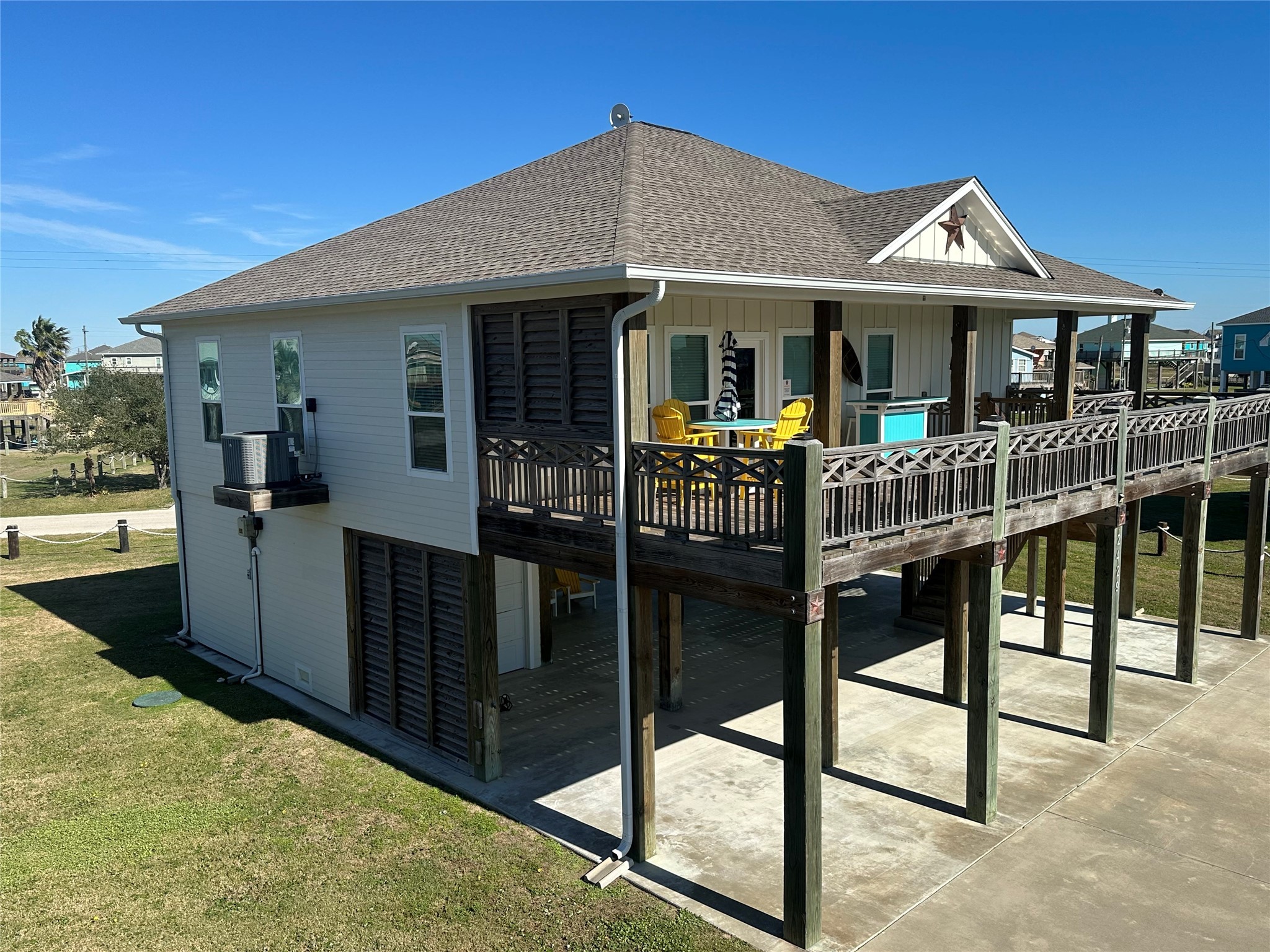 2429 Sand Castle Crystal Beach, TX 77650 - Photo 1 of 46 a front view of a house with yard porch and furniture
