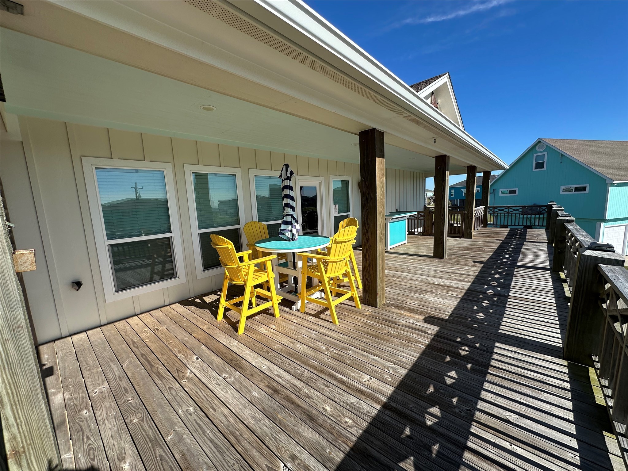 2429 Sand Castle Crystal Beach, TX 77650 - Photo 13 of 46 a dining room with furniture and wooden floor