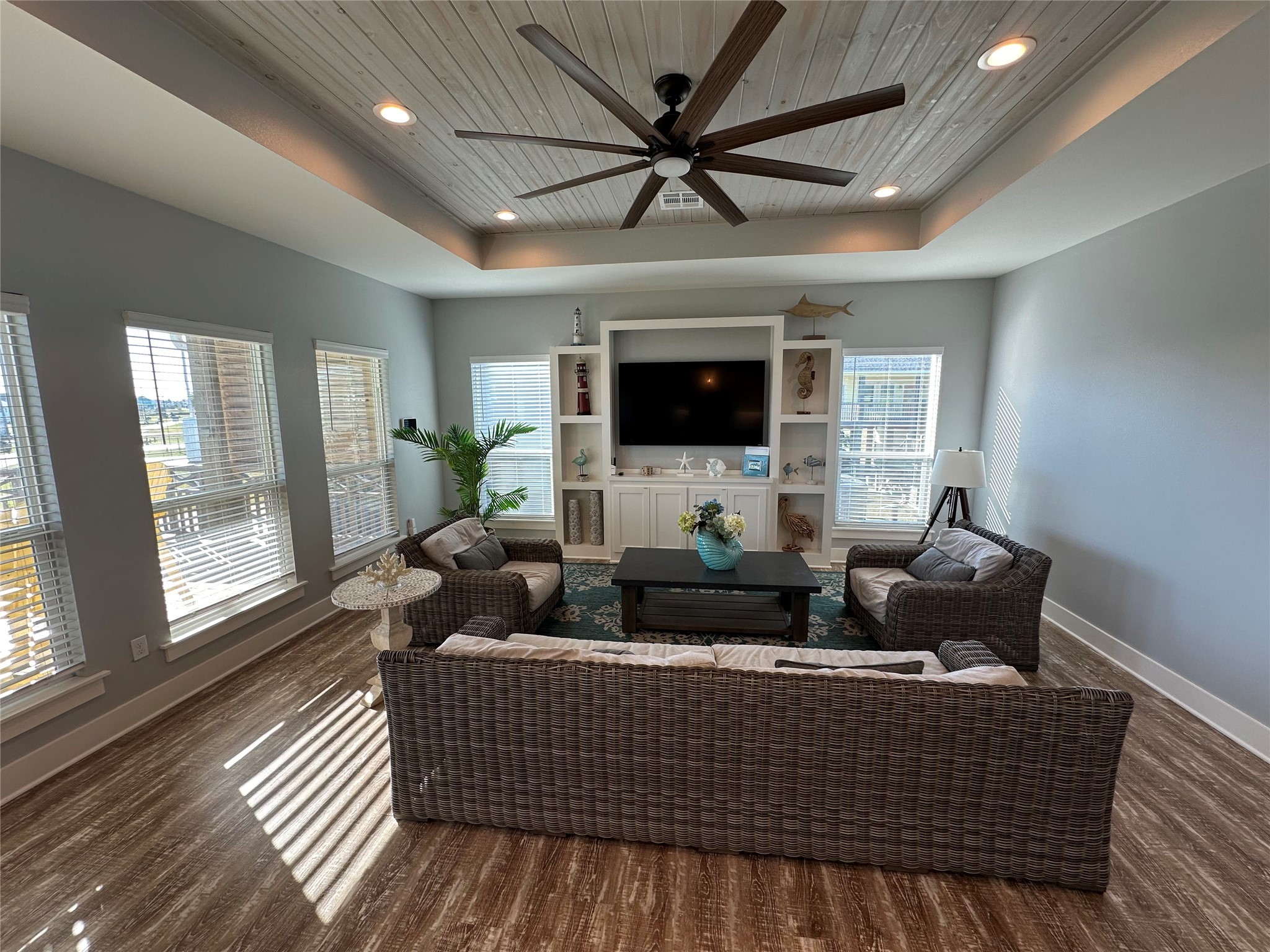 2429 Sand Castle Crystal Beach, TX 77650 - Photo 17 of 46 a living room with furniture wooden floor and a flat screen tv