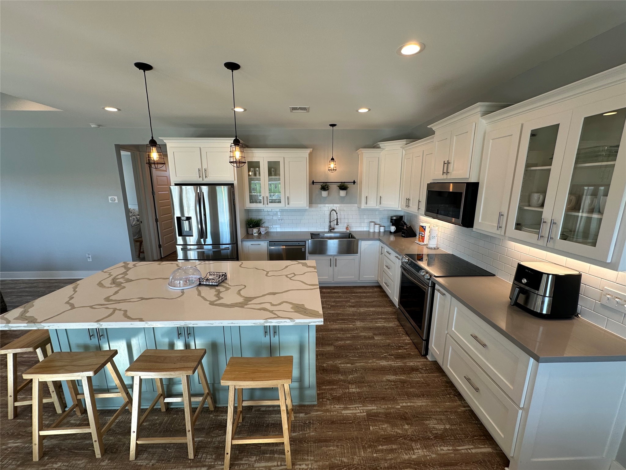 2429 Sand Castle Crystal Beach, TX 77650 - Photo 23 of 46 a large kitchen with kitchen island a dining table and chairs