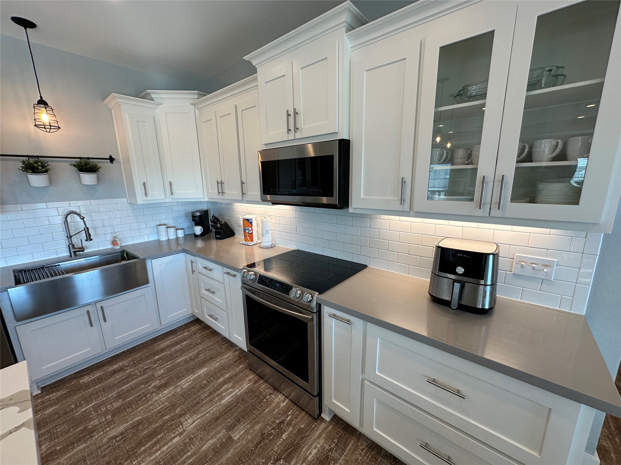 2429 Sand Castle Crystal Beach, TX 77650 - Photo 24 of 46 a kitchen with granite countertop a sink a stove and cabinets