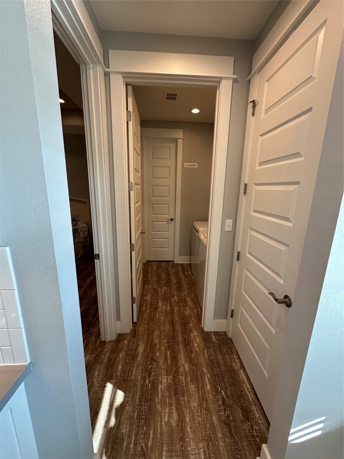 2429 Sand Castle Crystal Beach, TX 77650 - Photo 28 of 46 a view of a hallway with wooden floor and staircase