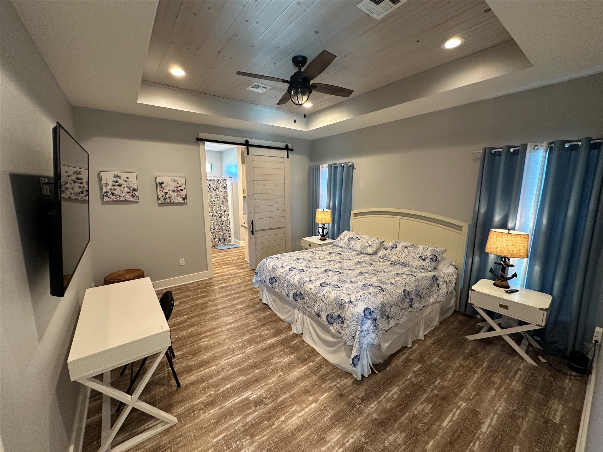 2429 Sand Castle Crystal Beach, TX 77650 - Photo 31 of 46 a living room with a bed furniture and a flat screen tv
