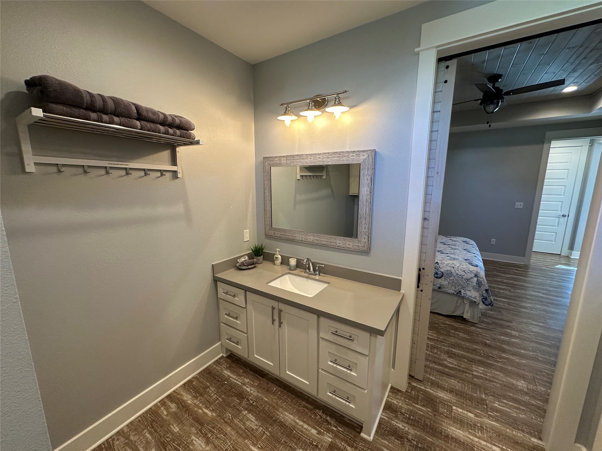 2429 Sand Castle Crystal Beach, TX 77650 - Photo 36 of 46 a bathroom with a sink a toilet and mirror