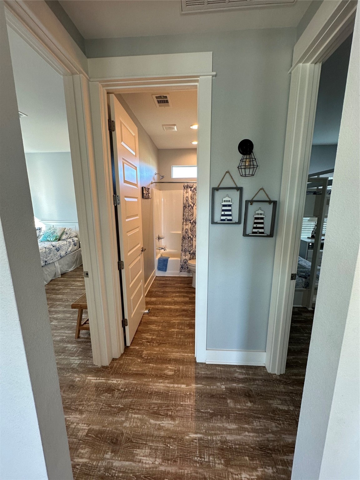 2429 Sand Castle Crystal Beach, TX 77650 - Photo 38 of 46 a view of a hallway view with wooden floor and staircase