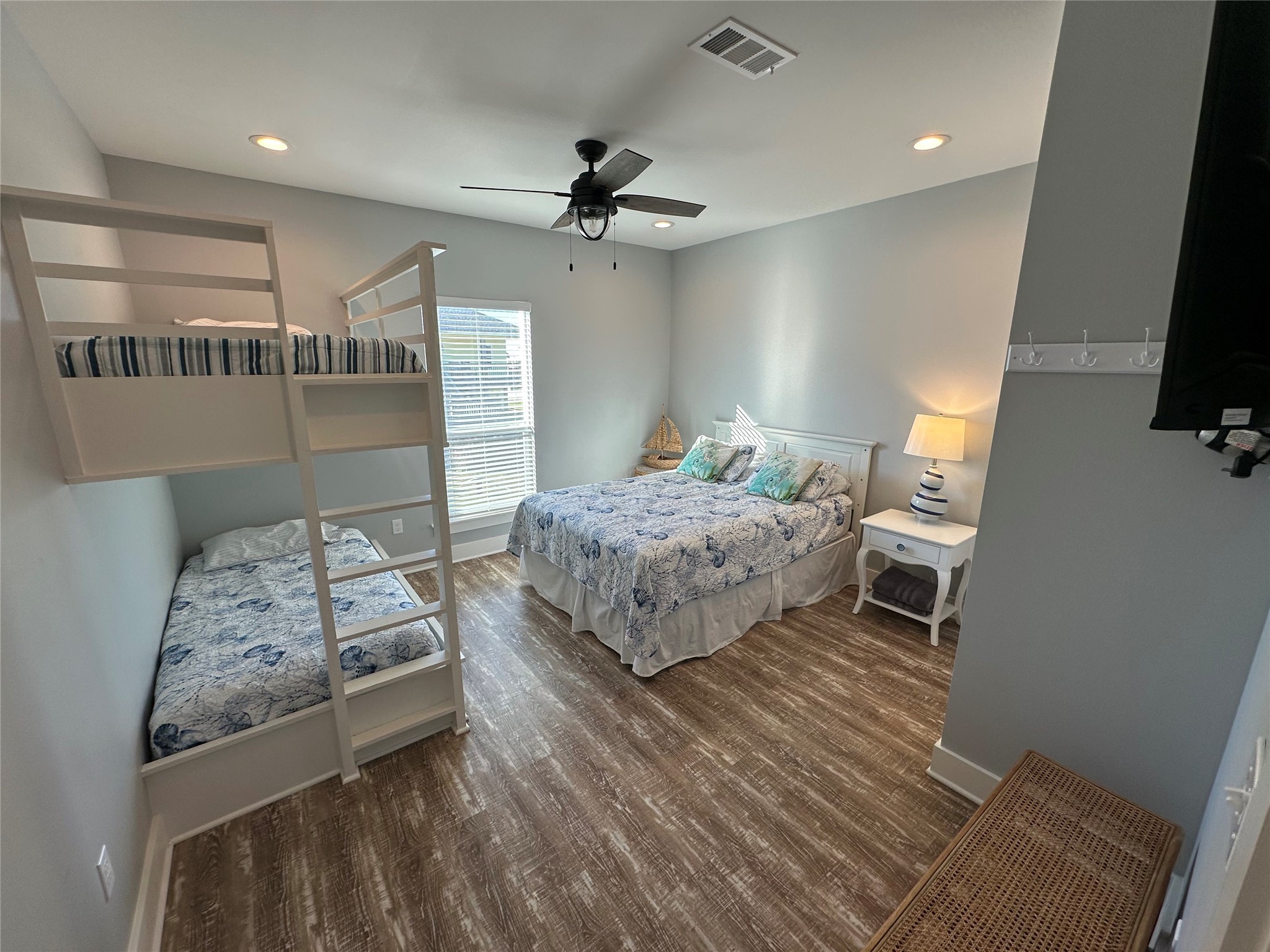 2429 Sand Castle Crystal Beach, TX 77650 - Photo 42 of 46 a bedroom with a bed window and a dresser