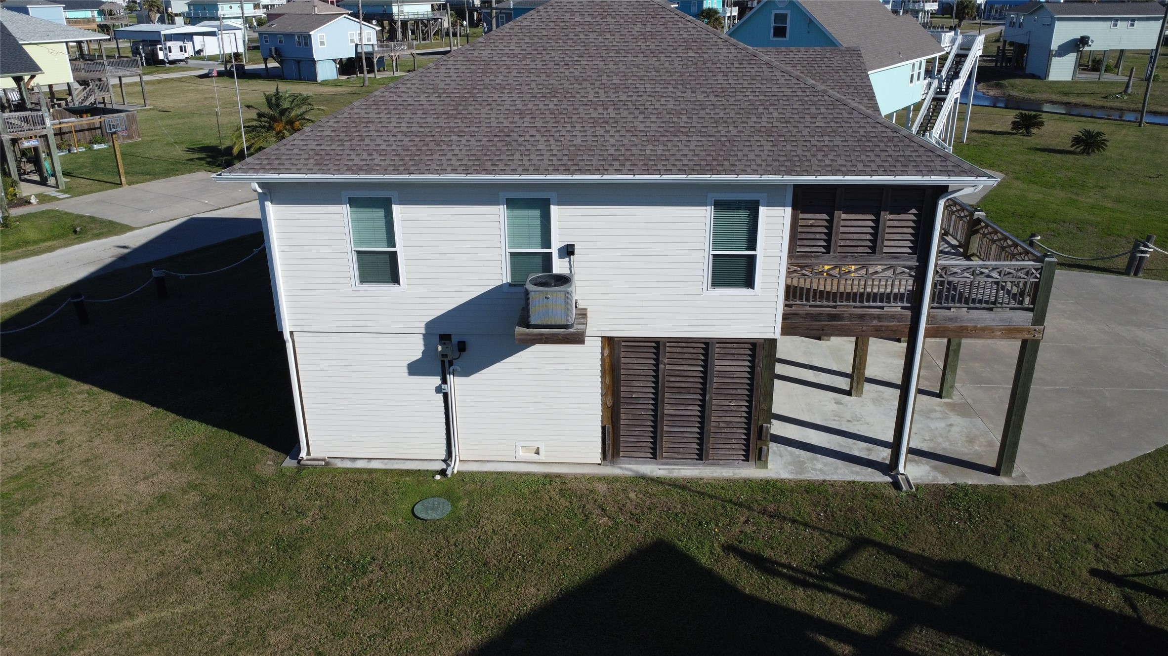2429 Sand Castle Crystal Beach, TX 77650 - Photo 45 of 46 a view of a house with a sink and a yard
