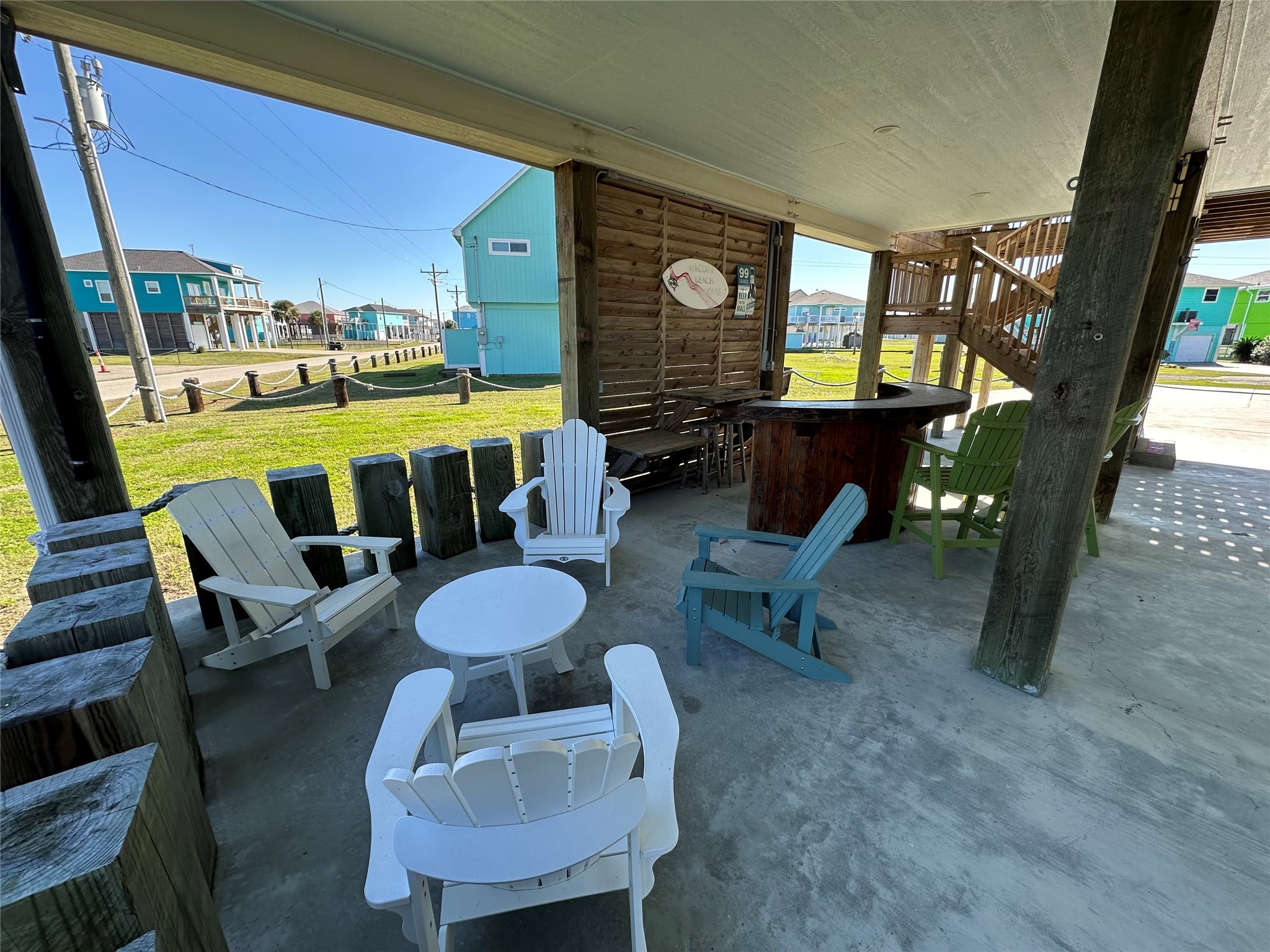 2429 Sand Castle Crystal Beach, TX 77650 - Photo 10 of 46 a living room with furniture and a floor to ceiling window