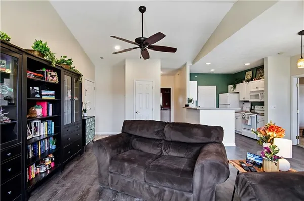 a living room with a fireplace furniture and a wooden floor