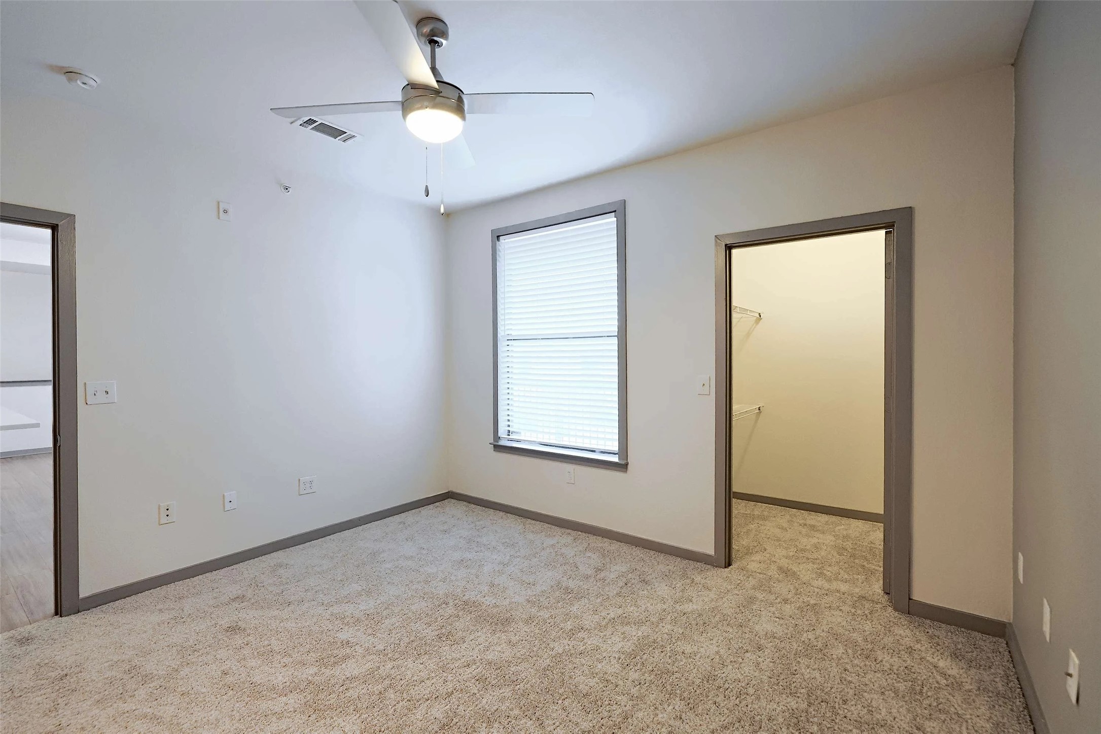 8515 Interstate 35, Unit 17239 Austin, TX 78744 - Photo 5 of 20 an empty room with windows and fan