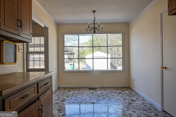 a kitchen with stainless steel appliances granite countertop a sink and a stove