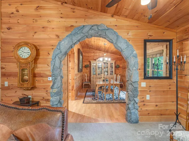 a view of lobby with a bench and mirror