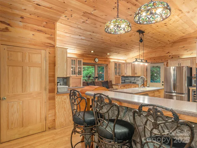 a view of a dining room with furniture wooden floor and chandelier