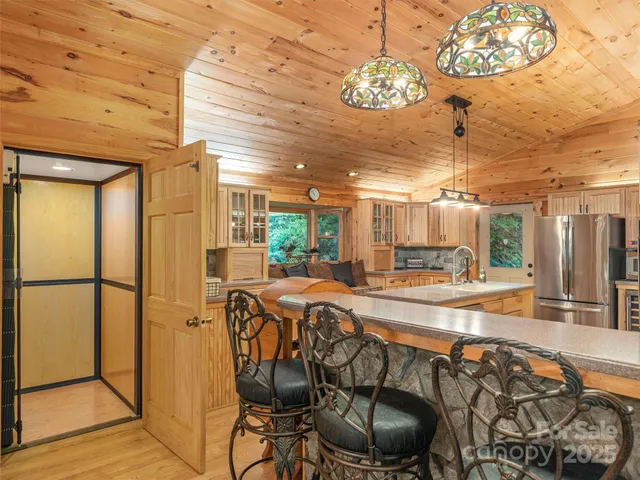 a view of a dining room with furniture wooden floor and chandelier