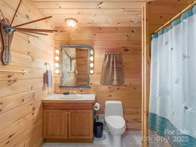 a kitchen with a sink and a mirror