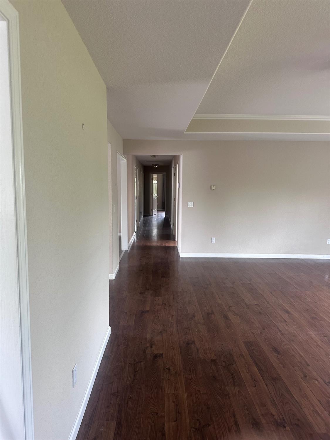 7124 Ospital Road Valley Springs, CA 95252 - Photo 27 of 37 a view of a hallway with wooden floor