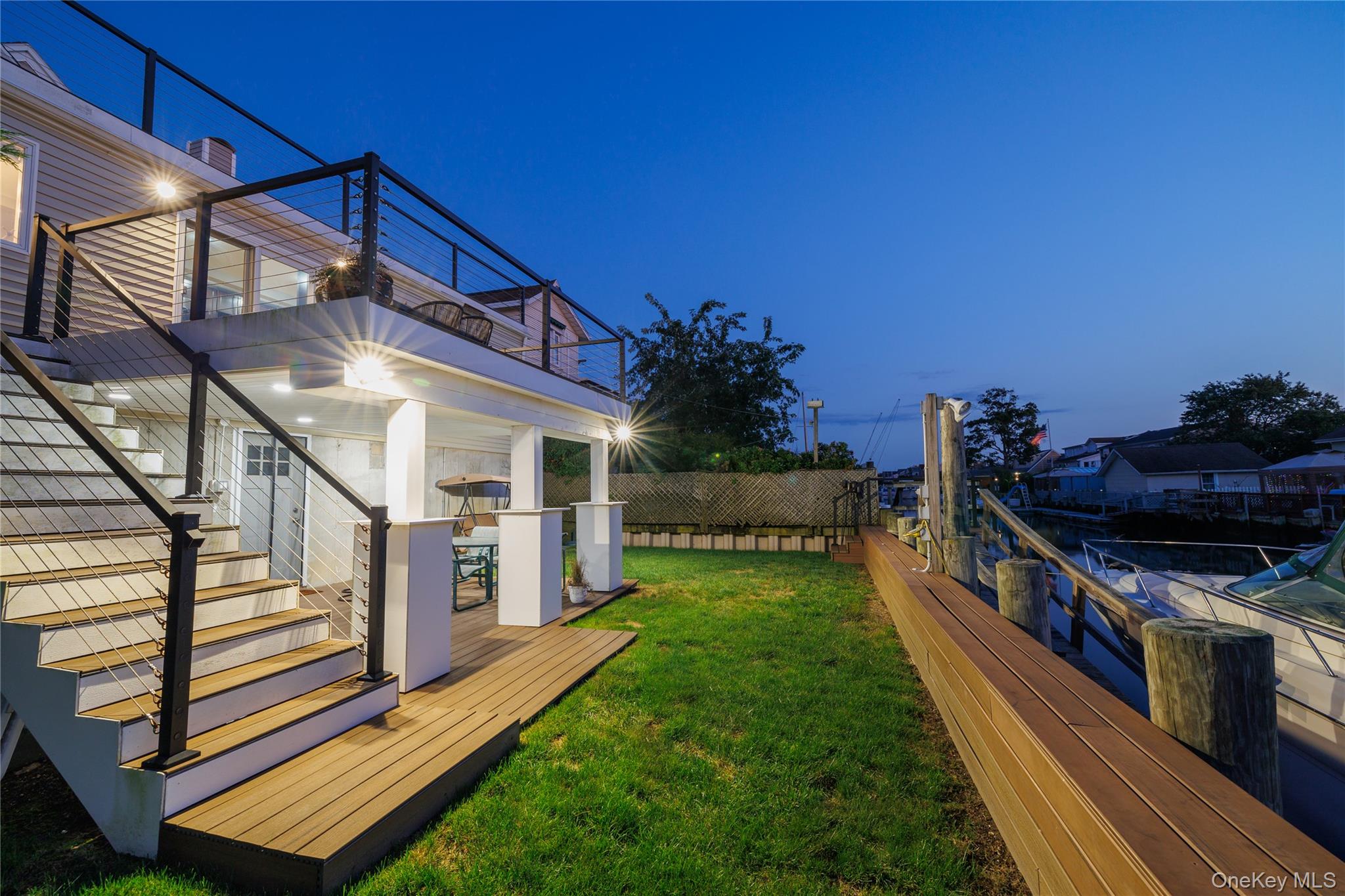 a view of a house with backyard and sitting area