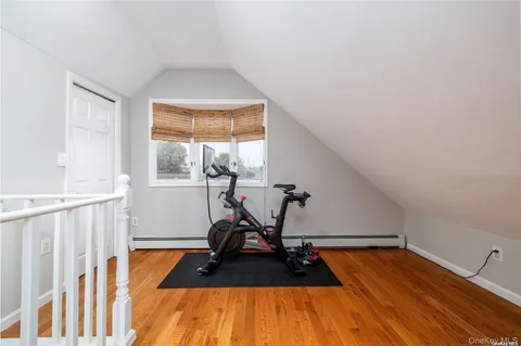 a work room with furniture and wooden floor