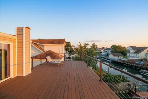 a view of balcony with furniture
