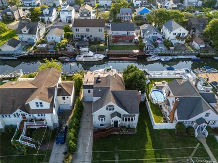 an aerial view of a houses with yard