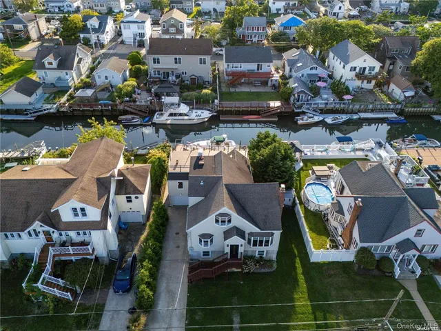 an aerial view of a houses with yard