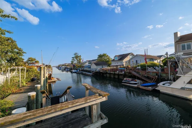 a view of a lake with boats and trees