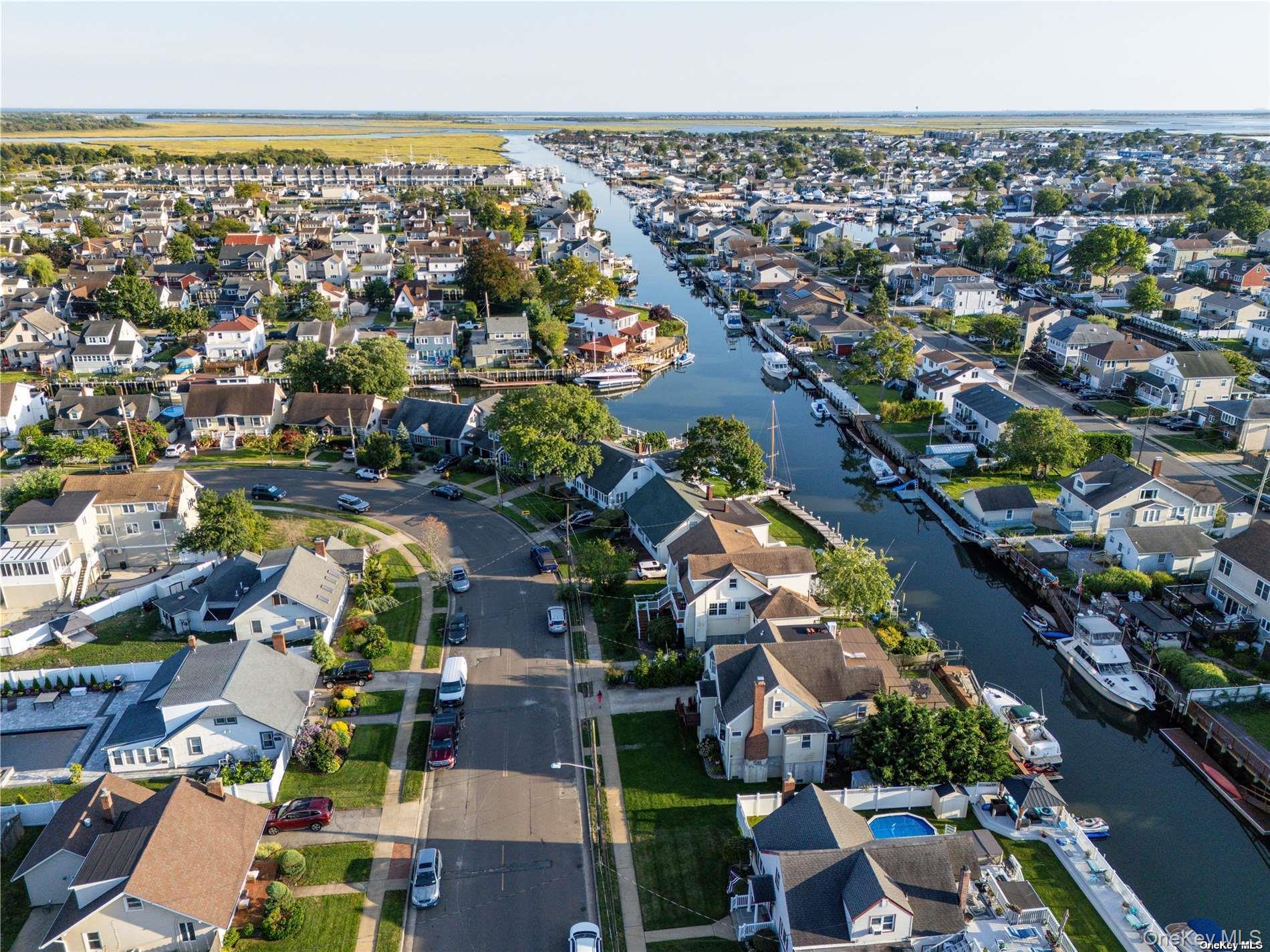 308 Bedell Street Freeport, NY 11520 - Photo 3 of 29 an aerial view of residential houses with outdoor space