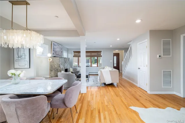 a spacious bedroom with a bed and chandelier