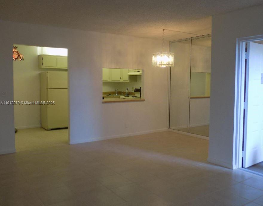 824 Sky Pine Way, Unit A1 West Palm Beach, FL 33415 - Photo 2 of 9 a view of an empty room with a bathroom